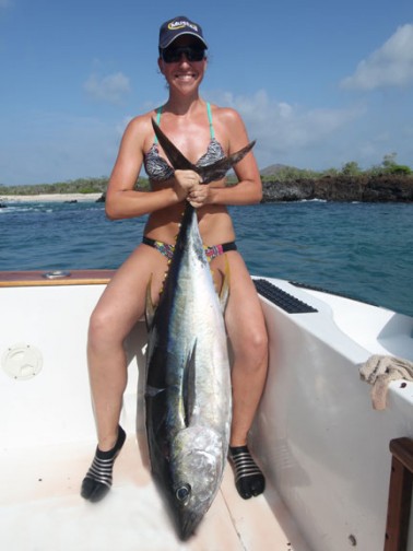 Tarin Keith with a yellowfin caught with 30lb tackle on a popper